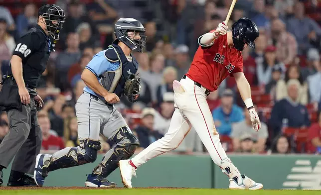 Boston Red Sox's Nick Sogard strikes out swinging in front of Tampa Bay Rays catcher Logan Driscoll to end the baseball game in the ninth inning, Friday, Sept. 27, 2024, in Boston. (AP Photo/Michael Dwyer)