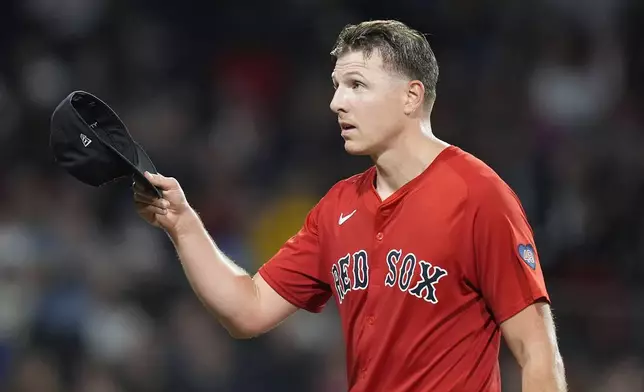 Boston Red Sox starting pitcher Nick Pivetta tips his cap to the crowd after being relieved during the seventh inning of a baseball game against the Tampa Bay Rays, Friday, Sept. 27, 2024, in Boston. (AP Photo/Michael Dwyer)