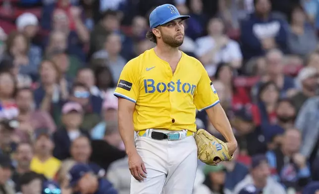 Boston Red Sox starting pitcher Kutter Crawford reacts after giving up an RBI single to Tampa Bay Rays' Junior Caminero during the fifth inning of a baseball game, Saturday, Sept. 28, 2024, in Boston. (AP Photo/Michael Dwyer)