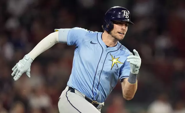 Tampa Bay Rays' Josh Lowe runs on his RBI double during the seventh inning of a baseball game against the Boston Red Sox, Friday, Sept. 27, 2024, in Boston. (AP Photo/Michael Dwyer)