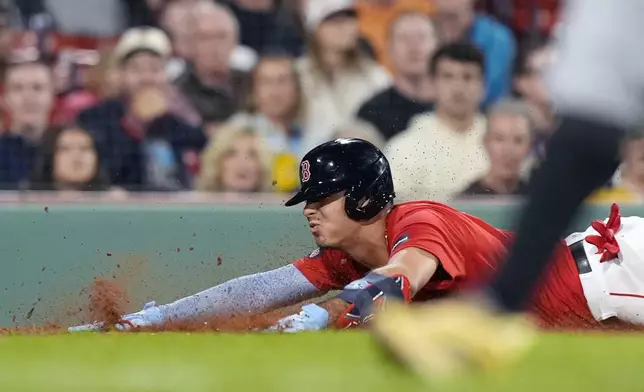 Boston Red Sox's Vaughn Grissom scores on a sacrifice fly by Nick Sogard during the seventh inning of a baseball game against the Tampa Bay Rays, Friday, Sept. 27, 2024, in Boston. (AP Photo/Michael Dwyer)