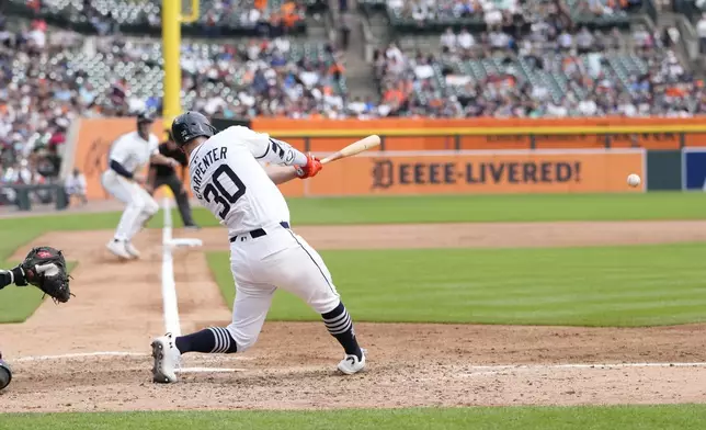 Detroit Tigers designated hitter Kerry Carpenter connects for a RBI single during the sixth inning of a baseball game against the Tampa Bay Rays, Thursday, Sept. 26, 2024, in Detroit. (AP Photo/Carlos Osorio)