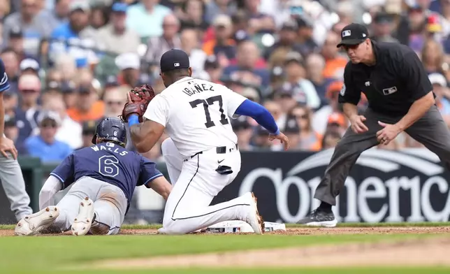 Tampa Bay Rays' Taylor Walls (6) safely returns to third on a pickoff attempt during the fifth inning of a baseball game against the Detroit Tigers, Thursday, Sept. 26, 2024, in Detroit. (AP Photo/Carlos Osorio)