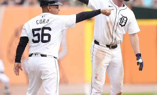 Detroit Tigers' Colt Keith reacts after sliding for a RBI triple during the sixth inning of a baseball game against the Tampa Bay Rays, Thursday, Sept. 26, 2024, in Detroit. (AP Photo/Carlos Osorio)