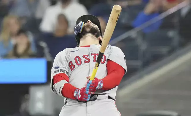 Boston Red Sox's Wilyer Abreu reacts after fouling out against the Toronto Blue Jays during the fifth inning of a baseball game in Toronto, Tuesday, Sept. 24, 2024. (Chris Young/The Canadian Press via AP)