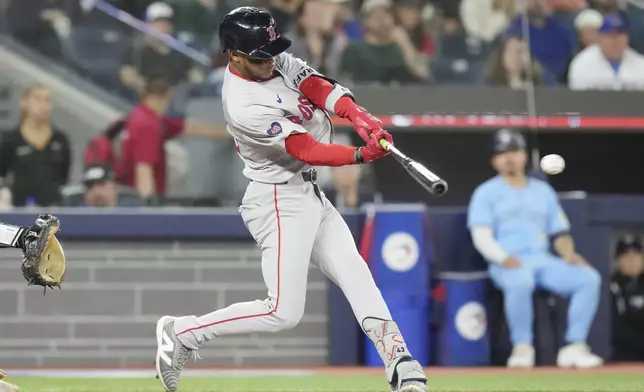 Boston Red Sox's Ceddanne Rafaela hits an RBI single during the seventh inning of a baseball game against the Toronto Blue Jays in Toronto, Tuesday, Sept. 24, 2024. (Chris Young/The Canadian Press via AP)