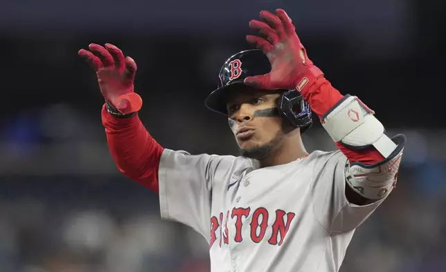 Boston Red Sox's Ceddanne Rafaela celebrates after hitting an RBI single during the seventh inning of a baseball game against the Toronto Blue Jays in Toronto, Tuesday, Sept. 24, 2024. (Chris Young/The Canadian Press via AP)