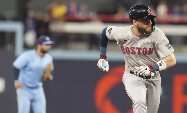 Boston Red Sox's Trevor Story advances to third base during the 10th inning of a baseball game against the Toronto Blue Jays in Toronto, Tuesday, Sept. 24, 2024. (Chris Young/The Canadian Press via AP)