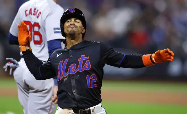 New York Mets shortstop Francisco Lindor (12) reacts after hitting an RBI single against the Boston Red Sox during the fourth inning of a baseball game, Monday, Sept. 2, 2024, in New York. (AP Photo/Noah K. Murray)