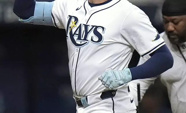 Tampa Bay Rays' Josh Lowe celebrates his solo home run off Boston Red Sox starting pitcher Nick Pivetta during the fifth inning of a baseball game Tuesday, Sept. 17, 2024, in St. Petersburg, Fla. (AP Photo/Chris O'Meara)