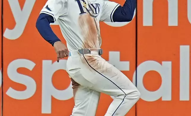 Tampa Bay Rays center fielder Jose Siri makes a catch on a fly out by Boston Red Sox's Tyler O'Neill during the seventh inning of a baseball game Thursday, Sept. 19, 2024, in St. Petersburg, Fla. (AP Photo/Chris O'Meara)