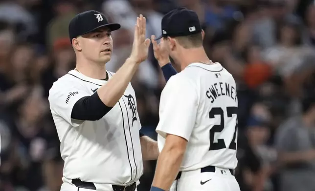 Detroit Tigers pitcher Tarik Skubal, left, celebrates with Trey Sweeney after a baseball game against the Boston Red Sox, Saturday, Aug. 31, 2024, in Detroit. (AP Photo/Paul Sancya)