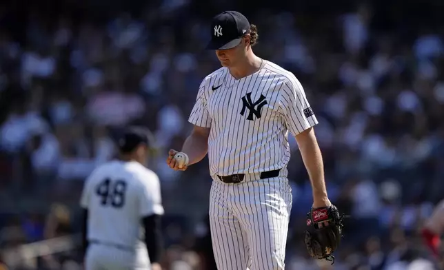 New York Yankees pitcher Gerrit Cole reacts after Boston Red Sox's Rafael Devers hit a two-run single during the fifth inning of a baseball game, Saturday, Sept. 14, 2024, in New York. (AP Photo/Frank Franklin II)