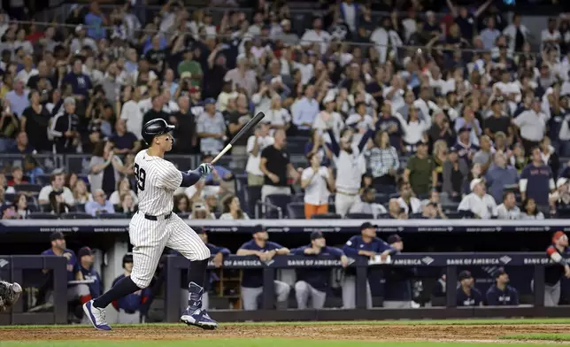 New York Yankees' Aaron Judge hits a grand slam during the seventh inning of a baseball game at bat Friday, Sept. 13, 2024, in New York. (AP Photo/Adam Hunger)