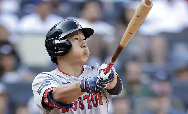 Boston Red Sox's Masataka Yoshida reacts after flying out during the eighth inning of a baseball game against the New York Yankees, Sunday, Sept. 15, 2024, in New York. (AP Photo/Adam Hunger)