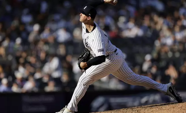 New York Yankees' Clay Holmes pitches during the eighth inning of a baseball game against the Boston Red Sox, Sunday, Sept. 15, 2024, in New York. (AP Photo/Adam Hunger)