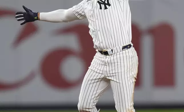 New York Yankees' Juan Soto reacts after hitting the winning base hit during the 10th inning of a baseball game against the Boston Red Sox at Yankee Stadium, Thursday, Sept. 12, 2024, in New York. (AP Photo/Seth Wenig)