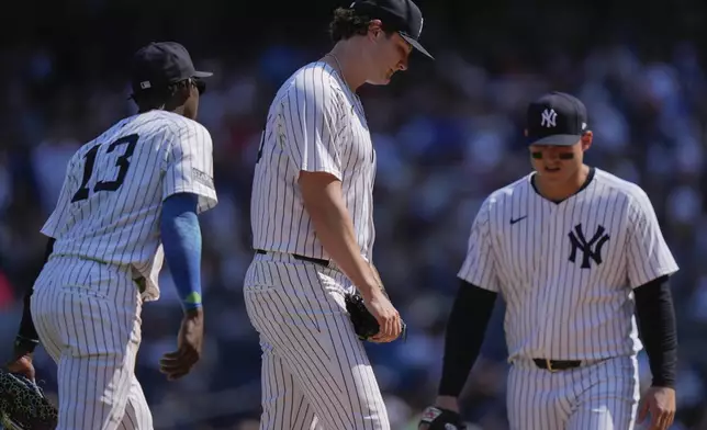 New York Yankees pitcher Gerrit Cole reacts after Boston Red Sox's Masataka Yoshida, of Japan, hit a two-run single during the fifth inning of a baseball game Saturday, Sept. 14, 2024, in New York. (AP Photo/Frank Franklin II)