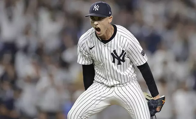 New York Yankees relief pitcher Luke Weaver reacts after the final out of a baseball game against the Boston Red Sox Friday, Sept. 13, 2024, in New York. (AP Photo/Adam Hunger)