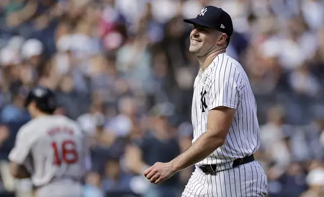 New York Yankees starting pitcher Carlos Rodon walks off the field during the fifth inning of a baseball game against the Boston Red Sox, Sunday, Sept. 15, 2024, in New York. (AP Photo/Adam Hunger)