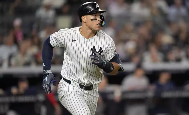 New York Yankees' Aaron Judge runs to first base during the seventh inning of a baseball game against the Boston Red Sox at Yankee Stadium, Thursday, Sept. 12, 2024, in New York. (AP Photo/Seth Wenig)