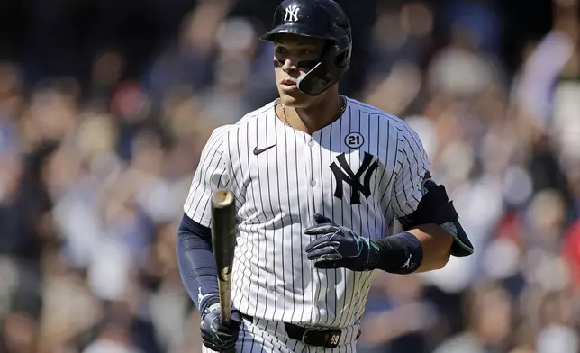 New York Yankees' Aaron Judge reacts after hitting a two-run home run during the third inning of a baseball game against the Boston Red Sox, Sunday, Sept. 15, 2024, in New York. (AP Photo/Adam Hunger)