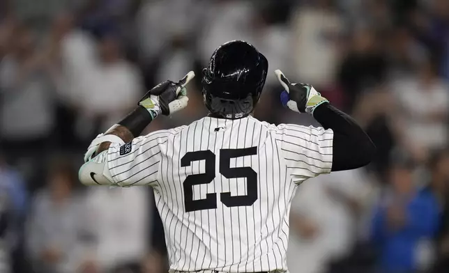 New York Yankees' Gleyber Torres celebrates as he rounds the bases after hitting a home run during the first inning of a baseball game against the Boston Red Sox at Yankee Stadium, Thursday, Sept. 12, 2024, in New York. (AP Photo/Seth Wenig)