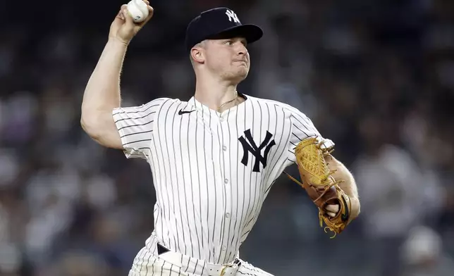 New York Yankees' Clarke Schmidt pitches during the sixth inning of a baseball game against the Boston Red Sox, Friday, Sept. 13, 2024, in New York. (AP Photo/Adam Hunger)