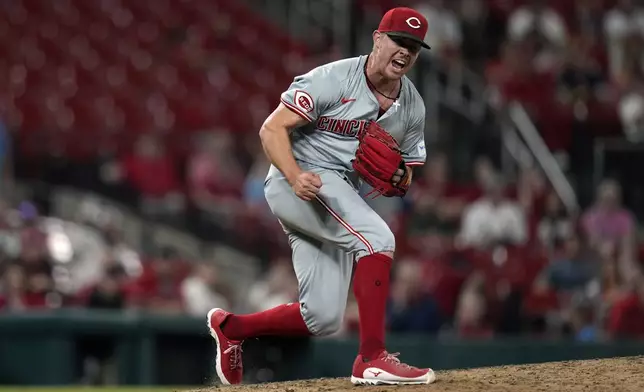 Cincinnati Reds relief pitcher Emilio Pagan celebrates after striking out St. Louis Cardinals' Matt Carpenter with the bases loaded to end a baseball game Tuesday, Sept. 10, 2024, in St. Louis. The Reds won 3-0. (AP Photo/Jeff Roberson)