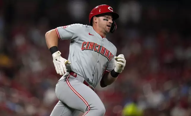 Cincinnati Reds' Spencer Steer rounds first on his way to a double during the fourth inning of a baseball game against the St. Louis Cardinals Wednesday, Sept. 11, 2024, in St. Louis. (AP Photo/Jeff Roberson)