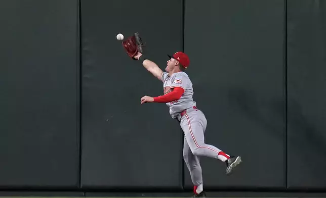 Cincinnati Reds center fielder TJ Friedl is unable to reach an RBI double by St. Louis Cardinals' Paul Goldschmidt during the eighth inning of a baseball game Wednesday, Sept. 11, 2024, in St. Louis. (AP Photo/Jeff Roberson)