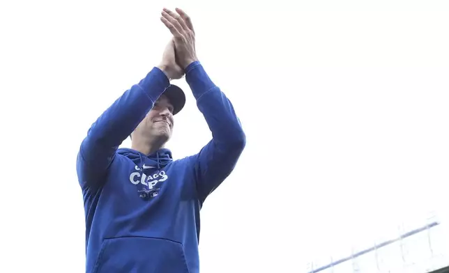 Chicago Cubs starting pitcher Kyle Hendricks applauds the crowd after the team's 3-0 win over the Cincinnati Reds in a baseball game Saturday, Sept. 28, 2024, in Chicago. (AP Photo/Charles Rex Arbogast)