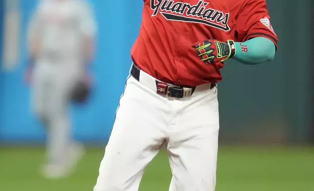 Cleveland Guardians' Jose Ramirez gestures after hitting a double in the seventh inning of a baseball game against the Cincinnati Reds in Cleveland, Tuesday, Sept. 24, 2024. (AP Photo/Sue Ogrocki)