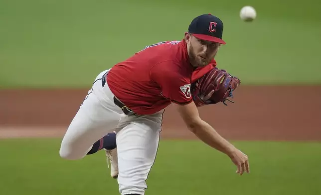 Cleveland Guardians' Tanner Bibee pitches in the first inning of a baseball game against the Cincinnati Reds in Cleveland, Tuesday, Sept. 24, 2024. (AP Photo/Sue Ogrocki)