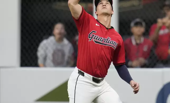 Cleveland Guardians right fielder Will Brennan catches a fly ball hit for an out by Cincinnati Reds' Spencer Steer in the second inning of a baseball game in Cleveland, Tuesday, Sept. 24, 2024. (AP Photo/Sue Ogrocki)