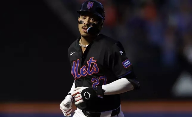 New York Mets' Mark Vientos rounds the bases after hitting a two-run home run during the first inning of a baseball game against the Cincinnati Reds, Friday, Sept. 6, 2024, in New York. (AP Photo/Adam Hunger)