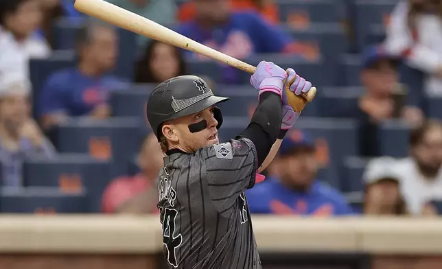 New York Mets' Harrison Bader hits a home run during the sixth inning of a baseball game against the Cincinnati Reds, Saturday, Sept. 7, 2024, in New York. (AP Photo/Adam Hunger)