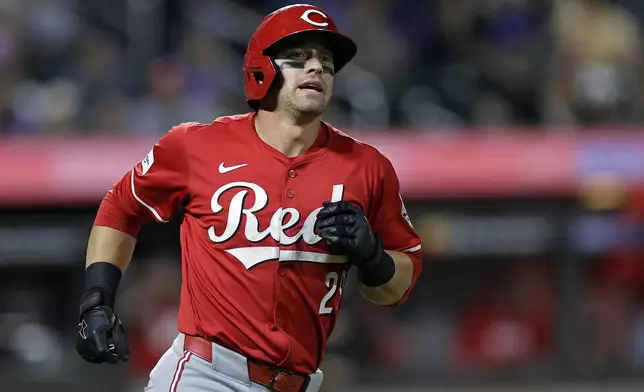 Cincinnati Reds' TJ Friedl reacts after hitting a two-run home run during the seventh inning of a baseball game against the New York Mets Friday, Sept. 6, 2024, in New York. (AP Photo/Adam Hunger)