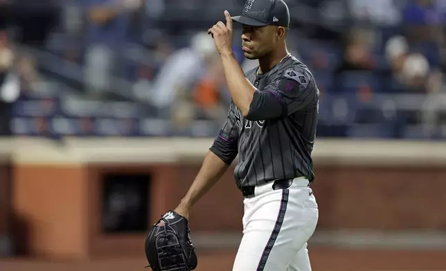 New York Mets pitcher Jose Quintana reacts while walking to the dugout after being taken out of the game during the seventh inning of a baseball game against the Cincinnati Reds, Saturday, Sept. 7, 2024, in New York. (AP Photo/Adam Hunger)