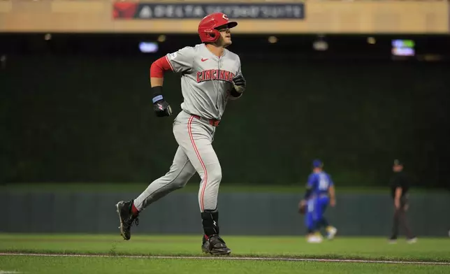 Cincinnati Reds' TJ Friedl runs on his a solo home run during the second inning of a baseball game against the Minnesota Twins, Friday, Sept. 13, 2024, in Minneapolis. (AP Photo/Nikolas Liepins)