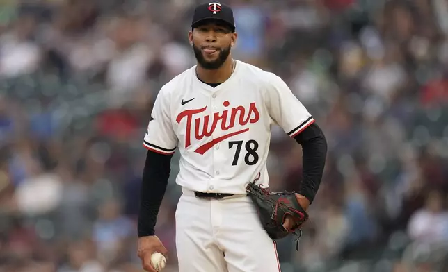 Minnesota Twins starting pitcher Simeon Woods Richardson (78) reacts after issuing a walk to Cincinnati Reds' Tyler Stephenson during the first inning of a baseball game, Saturday, Sept. 14, 2024, in Minneapolis. (AP Photo/Abbie Parr)