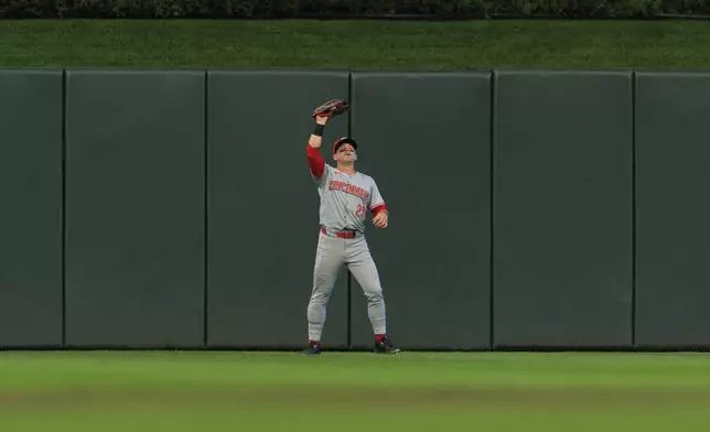 Cincinnati Reds outfielder TJ Friedl catches the ball for an out against the Minnesota Twins during the first inning of a baseball game, Friday, Sept. 13, 2024, in Minneapolis. (AP Photo/Nikolas Liepins)