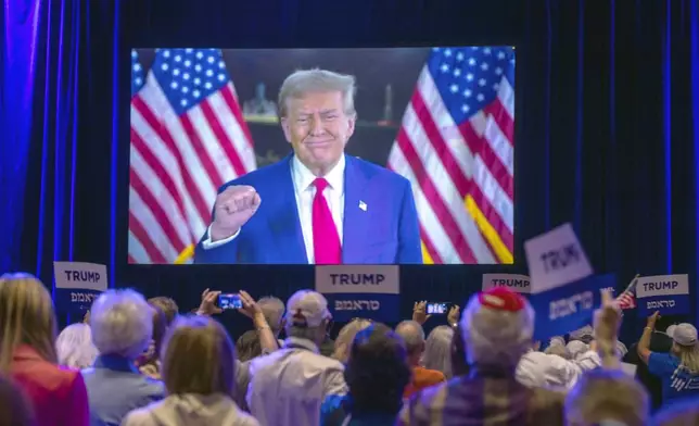 Republican presidential nominee former President Donald Trump appears via a live satellite video feed during the Republican Jewish Coalition annual leadership summit Thursday, Sept. 5, 2024, in Las Vegas. (Steve Marcus/Las Vegas Sun via AP)