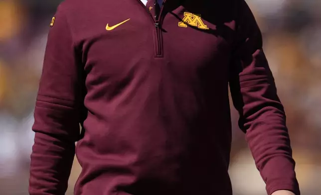 Minnesota head coach P. J. Fleck stands on the field during the first half of an NCAA college football game against Rhode Island, Saturday, Sept. 7, 2024, in Minneapolis. (AP Photo/Abbie Parr)