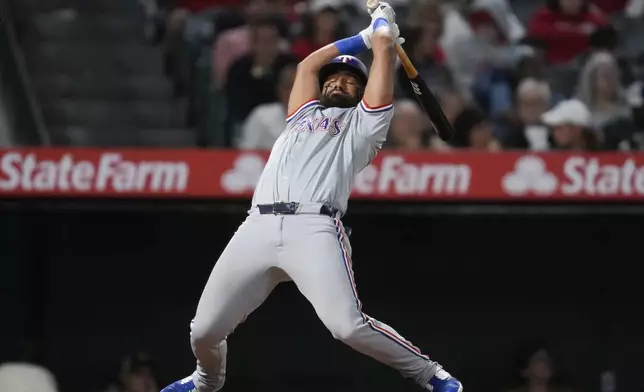 Texas Rangers' Ezequiel Duran avoids being hit by a pitch during the fifth inning of a baseball game against the Los Angeles Angels in Anaheim, Calif., Saturday, Sept. 28, 2024. (AP Photo/Ashley Landis)