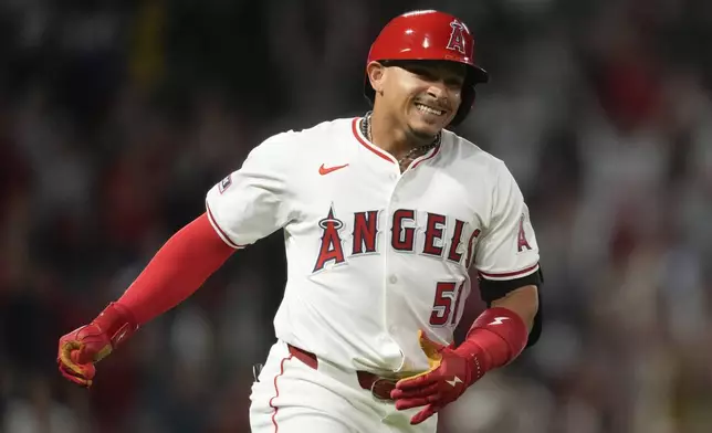 Los Angeles Angels' Gustavo Campero runs the bases after hitting a home run during the third inning of a baseball game against the Texas Rangers in Anaheim, Calif., Saturday, Sept. 28, 2024. Brandon Drury and Logan O'Hoppe also scored. (AP Photo/Ashley Landis)