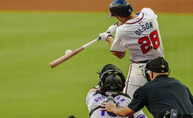 Atlanta Braves' Matt Olson (28) hits the ball to center field and it is caught in the first inning of a baseball game against the Colorado Rockies, Thursday, Sept. 5, 2024, in Atlanta. (AP Photo/Jason Allen)