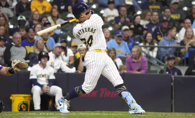 Milwaukee Brewers' William Contreras (24) hits a two-run home run during the third inning of a baseball game against the Colorado Rockies, Saturday, Sept. 7, 2024, in Milwaukee. (AP Photo/Kayla Wolf)