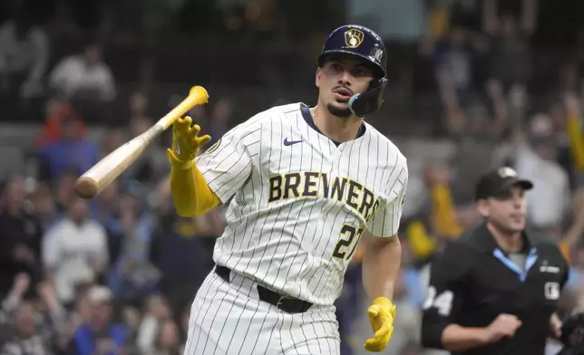 Milwaukee Brewers' Willy Adames (27) flips his bat after hitting a home run during the first inning of a baseball game against the Colorado Rockies, Saturday, Sept. 7, 2024, in Milwaukee. (AP Photo/Kayla Wolf)