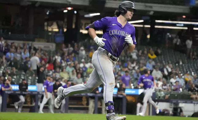 Colorado Rockies' Michael Toglia rounds the bases after hitting a three-run home run during the sixth inning of a baseball game against the Milwaukee Brewers, Friday, Sept. 6, 2024, in Milwaukee. (AP Photo/Kayla Wolf)